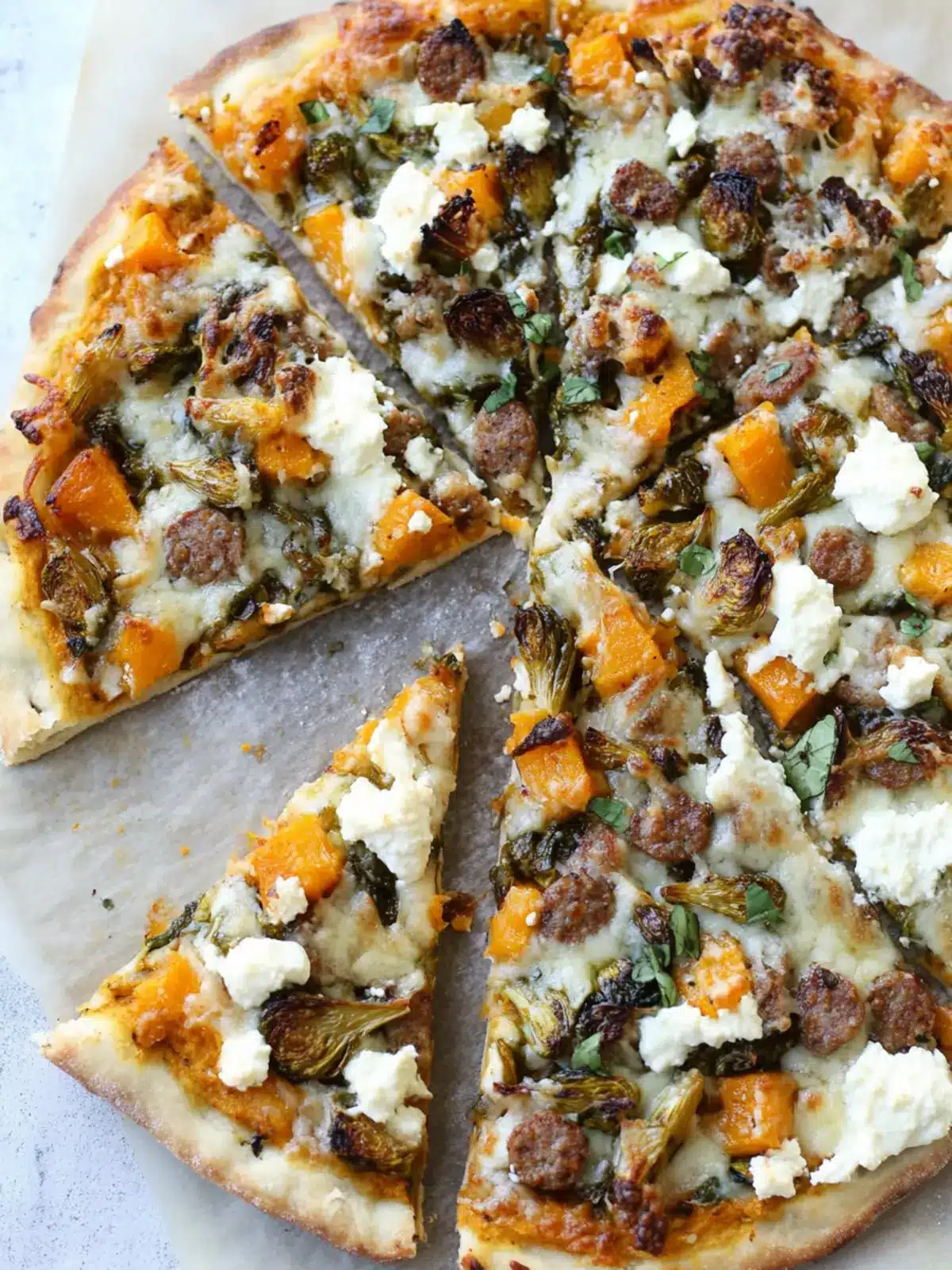 Butternut Squash Pizza with Brussels, Spicy Sausage & Ricotta 3 Butternut Squash, Brussels, Spicy Sausage, and Ricotta Pizza