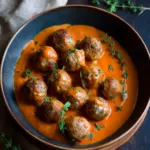 Savory Greek Meatballs with Zesty Roasted Red Pepper Sauce 41 Greek Meatballs with Roasted Red Pepper Sauce